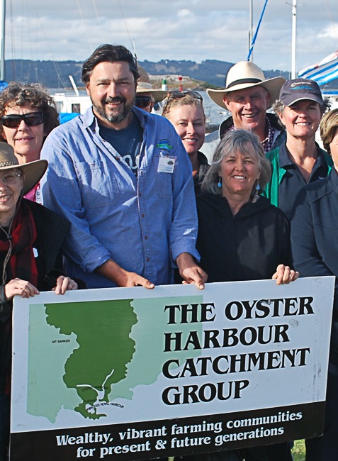 A group of people holding a sign for the Oyster Harbour Catchment Group