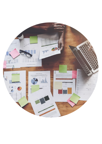 Stock image overhead view of graphs and charts on pages on a desk