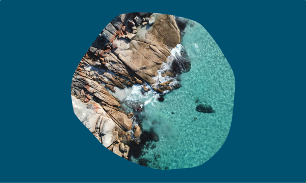 Shore line with rocks and aqua water